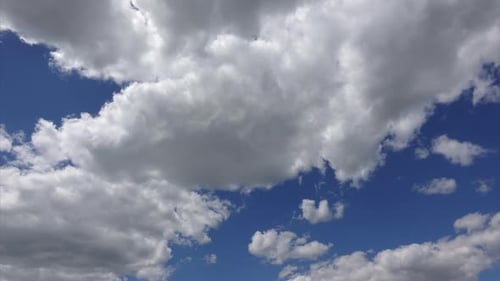 Clouds Moving Across a Deep Blue Sky