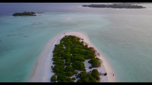 Aerial top down sky of perfect island beach adventure by blue green lagoon with white sandy backgrou