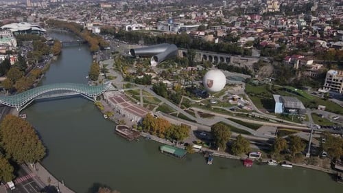 Landmark of Tbilisi Bridge of Peace Over the River Kura Cityscape View