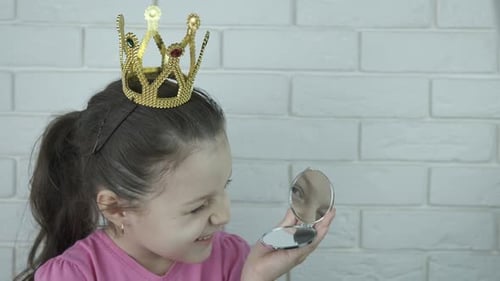 Child with Crown Looks at Herself in Mirror