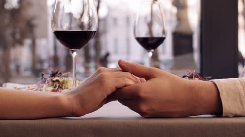 Man and Woman Holding Hands Lovers Connection Romantic Date in Cafe Close Up
