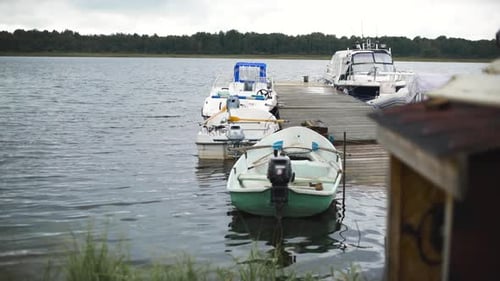 A Pier with Small Boats Is Seen in the Fishing Village