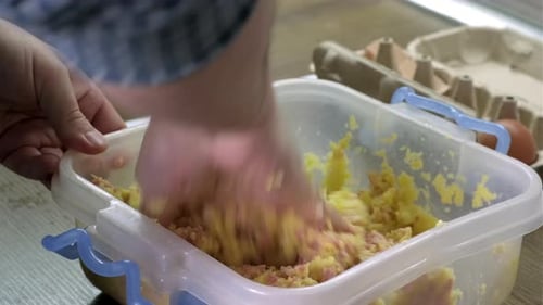 Mixing Food Ingredients in Bowl with Hand