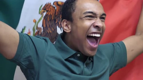 Young Adult Shouting in Front of National Flag