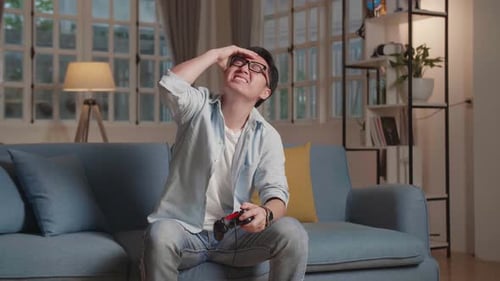 Frustrated Man Losing at Video Games at Home