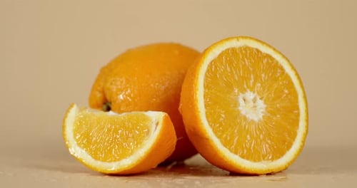 On Juicy Oranges Falling Water Drops.