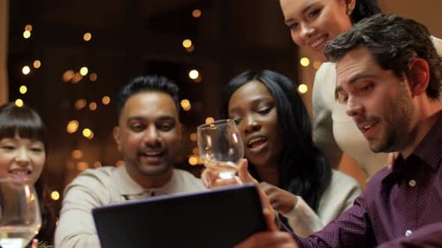 Friends Having Birthday Party Using Tablet