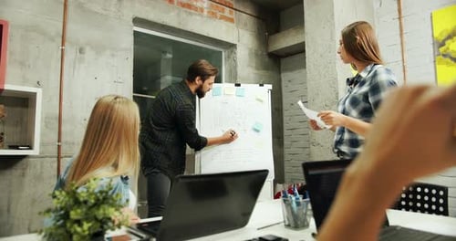 Creative Team Brainstorming Ideas in Urban Workplace