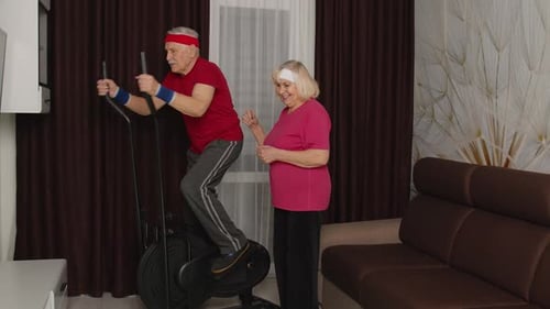 Senior Couple Exercising Together at Home