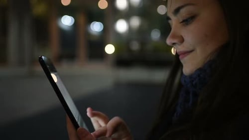 Young business woman outdoor using tablet hand hold looking touchscreen