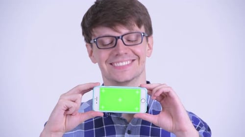 Young Adult Holding Phone with Green Screen