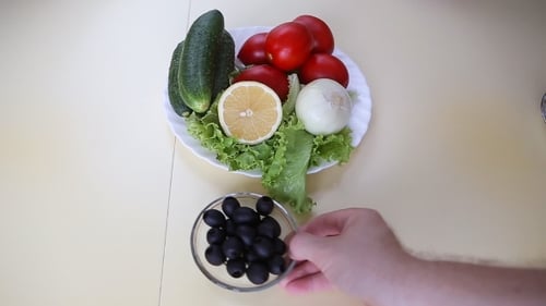 Plates With Greek Salad And Ingridients
