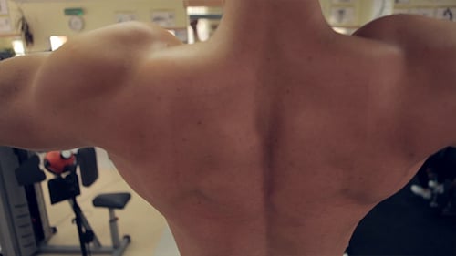 Men Exercising In Gym