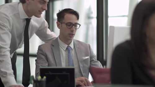 A Grey Suited Caucasian Man Works In A Attractive Modern Office (3 Of 3)