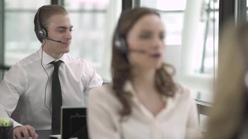 Blonde Caucasian Man Works In A Attractive Modern Call Center (1 Of 4)
