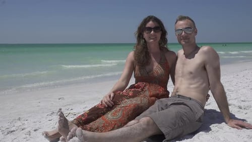 Couple Relaxing On A Morning Beach (1 Of 4)