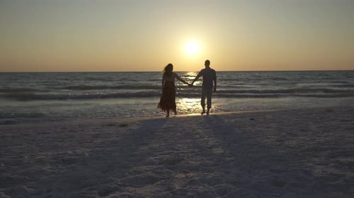Couple Walking On Beach At Sunset (4 Of 23)