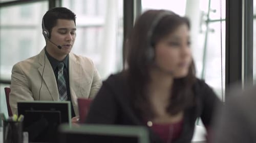 Hispanic Man Works In A Attractive Modern Call Center (1 Of 4)