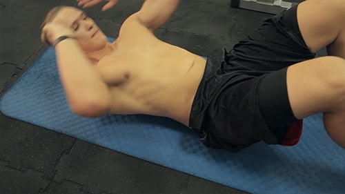 Men Exercising Abs In Gym