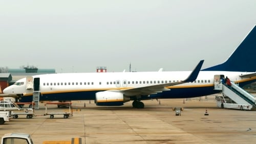 Passenger Airplane With Few People Boarding