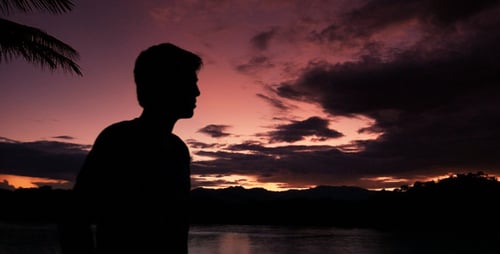 Silhouette Of Man At Sunset