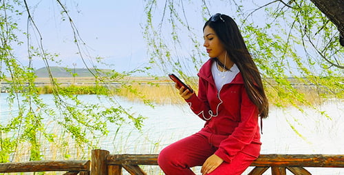 Girl Listening to Music on a Smartphone