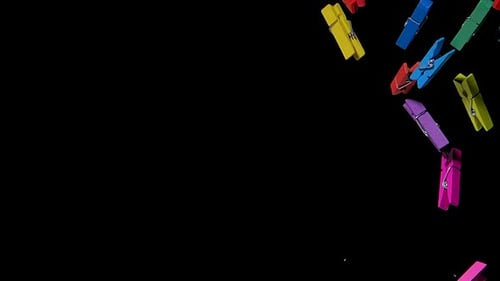Lots of Brightly Colored Wooden Clothespins Fly Up and Then Fall Down