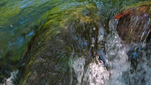 Stream Water Rapidly Falling Off Rock.