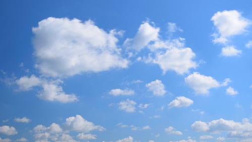 Scenic Sky with Fluffy Clouds Passing By