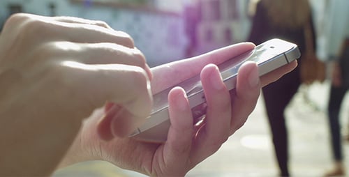 Woman Using Mobile Phone in Urban Setting