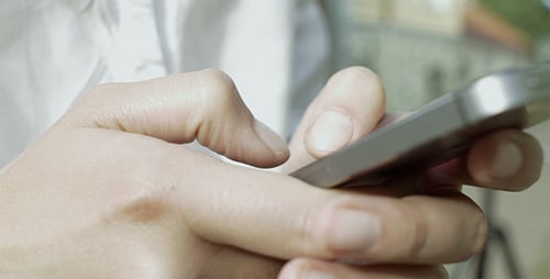 Fingers Using Silver Smartphone Indoors