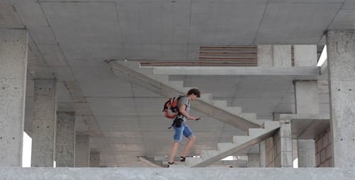 Unfinished Concrete Building Interior with Staircase
