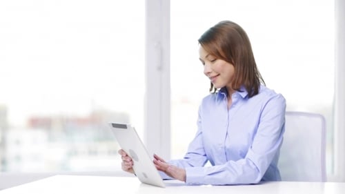 Businesswoman With Tablet Pc In Office