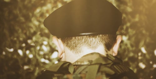 Soldier in Camouflage Uniform Standing in Forest