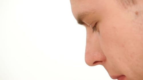 Close Up of Person Eating Leafy Green Vegetable
