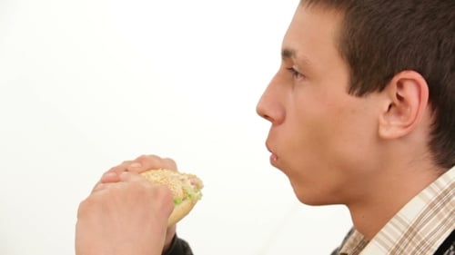 Man Eats A Sandwich Isolated Close-up