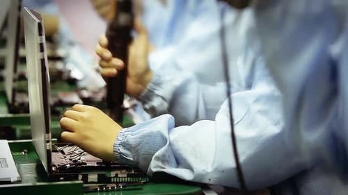 Worker Hands Manufacturing Laptop Computers. Timelapse.