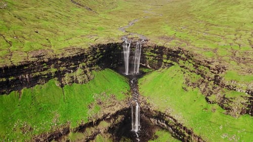 Aerial View of Stunning Waterfall in Faroe Islands