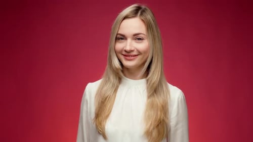 Smiling Woman with Blonde Hair Winks