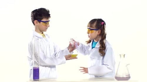 Children in Lab Coats Conducting Science Experiment