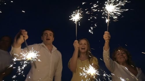 Friends Celebrate with Sparklers at Night