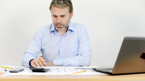 Engineer Working With Blueprints