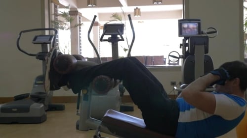 Man Doing Abs Exercise In The Gym