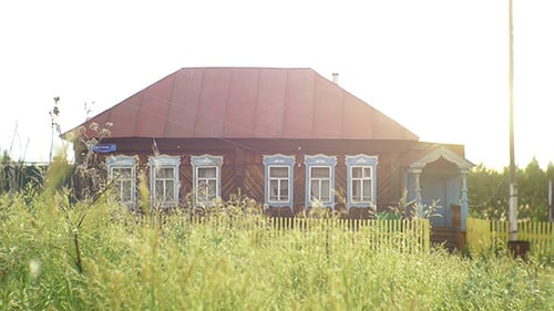 Wooden House with Grass in the Countryside