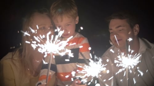 Son And His Parents Catching Sparkles Of a Bengale