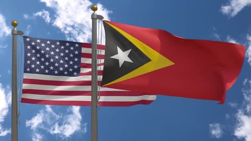 USA-Flagge gegen Osttimor-Flagge auf Fahnenmast