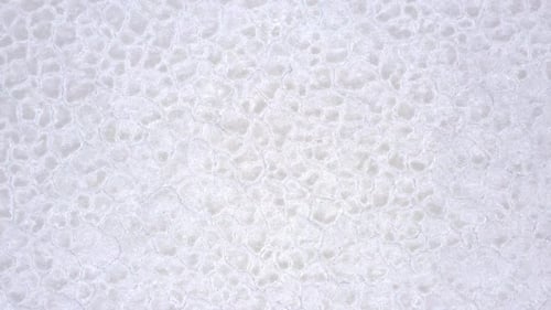 Rising aerial view spinning above the Bonneville Salt Flats in Utah