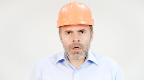Man in Hard Hat Expressing Surprise