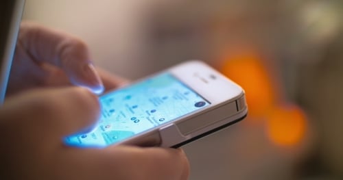 Close Up of Hand Using Smartphone App