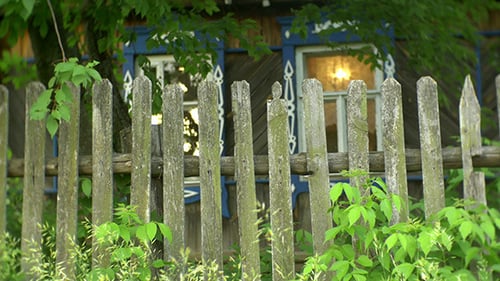 Old Wooden Fence near Rural Cottage
